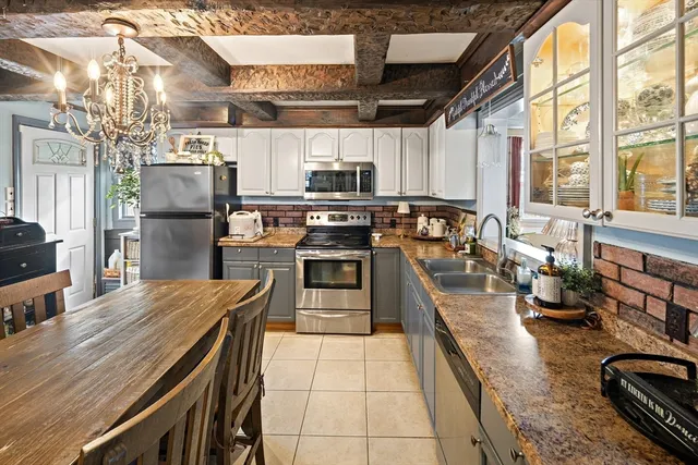 a view of a livingroom with furniture and windows