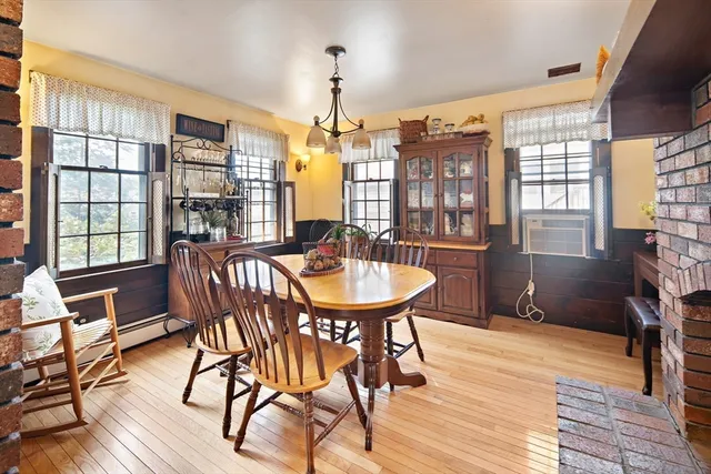 a large bed sitting in a bedroom next to a window