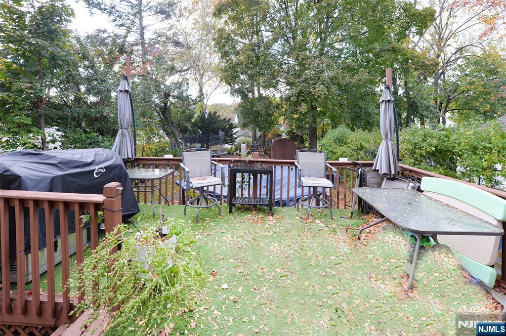 110 3rd Avenue Hawthorne, NJ 07506 - Photo 13 of 17 a view of a patio with a table chairs and a backyard