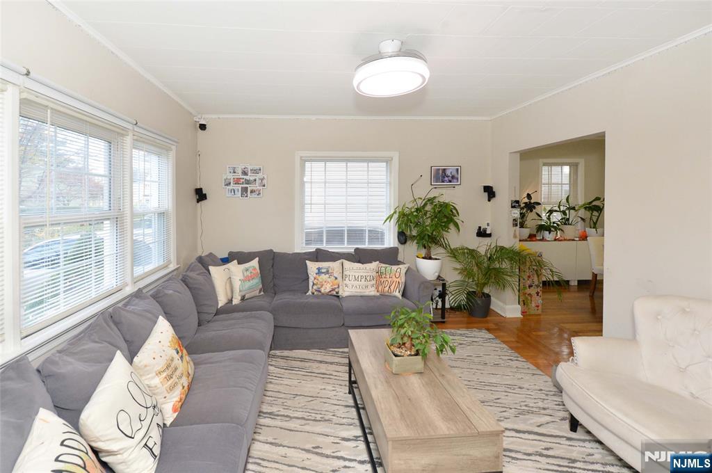 110 3rd Avenue Hawthorne, NJ 07506 - Photo 4 of 17 a living room with furniture and a large window