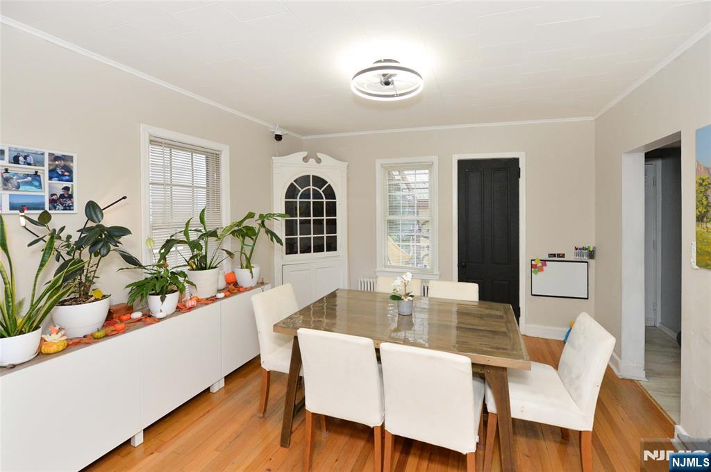 110 3rd Avenue Hawthorne, NJ 07506 - Photo 5 of 17 a dining room with furniture potted plants and wooden floor