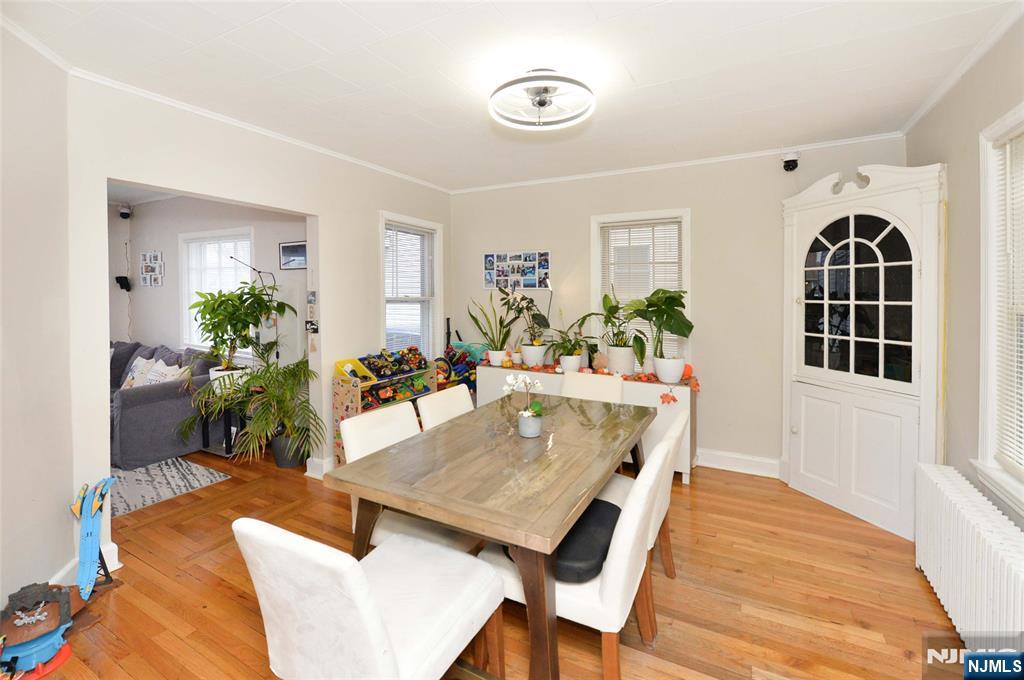 110 3rd Avenue Hawthorne, NJ 07506 - Photo 6 of 17 a living room with furniture a chandelier and a table