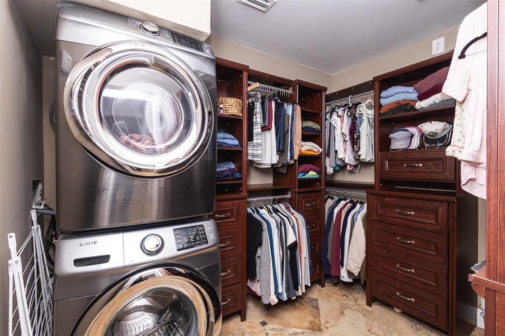 1001 Nottingham Street Orlando, FL 32803 - Photo 26 of 49 a view of walk in closet with clothes shoes and a washer