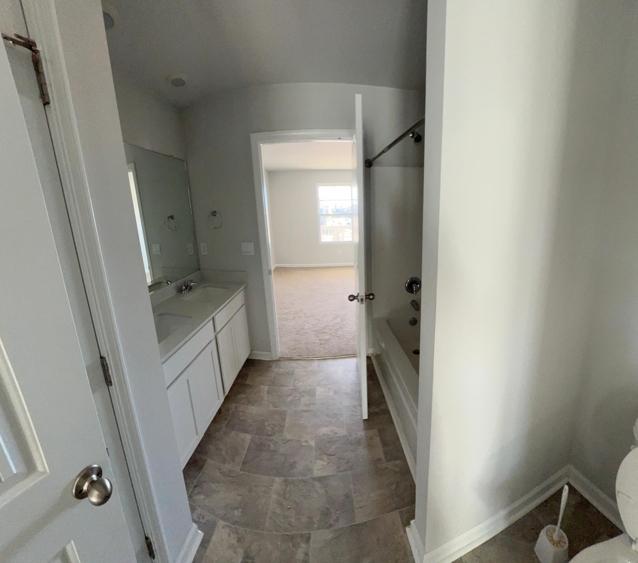 4145 Dolly Way Antioch, TN 37013 - Photo 17 of 24 a bathroom with a tub sink and mirror
