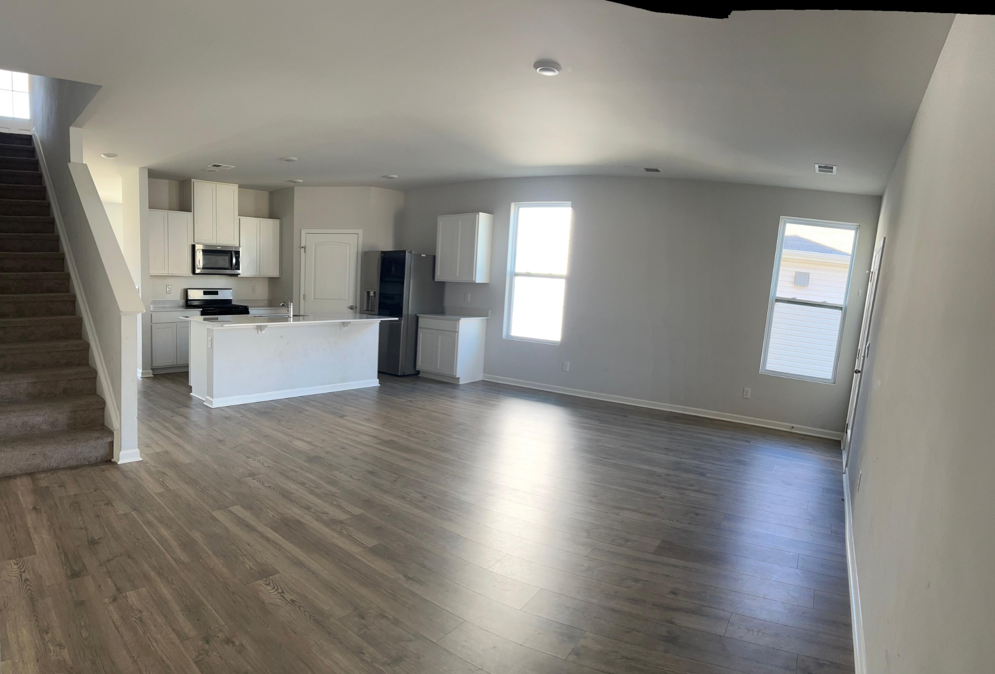 4145 Dolly Way Antioch, TN 37013 - Photo 6 of 24 a view of a kitchen and dining room with wooden floor