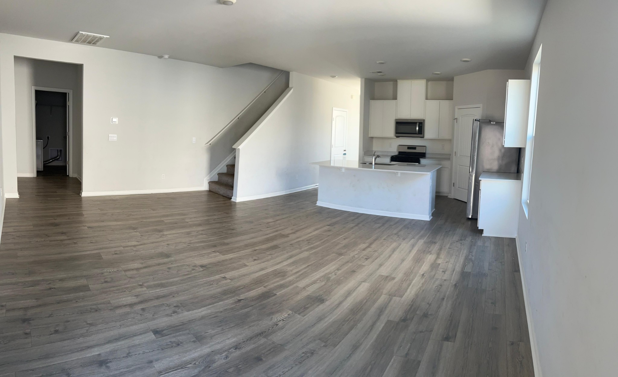 4145 Dolly Way Antioch, TN 37013 - Photo 7 of 24 a view of kitchen with cabinets stainless steel appliances and wooden floor