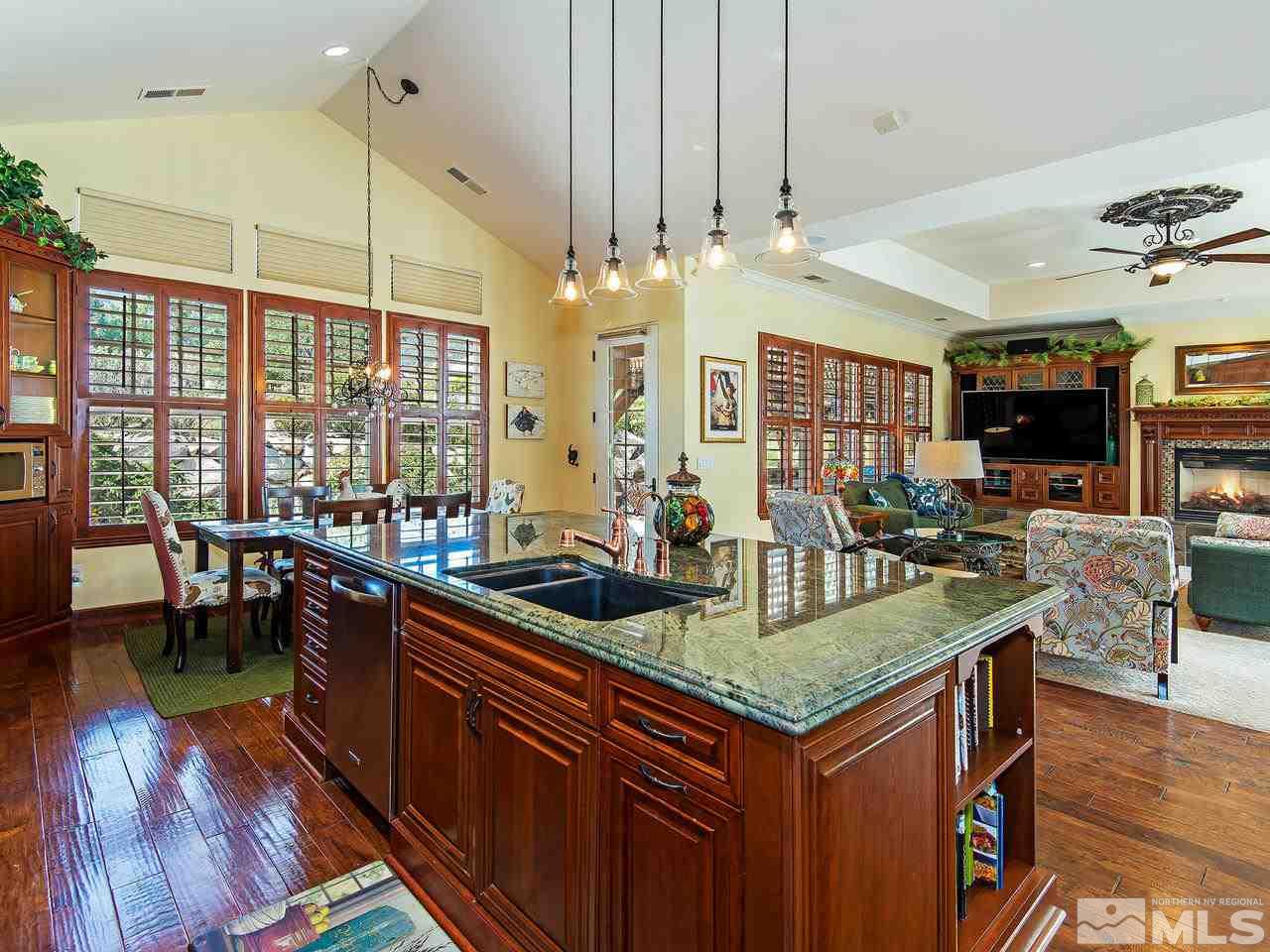 16885 Delacroix Reno, NV 89511 - Photo 11 of 25 a kitchen with stainless steel appliances granite countertop a stove and cabinets