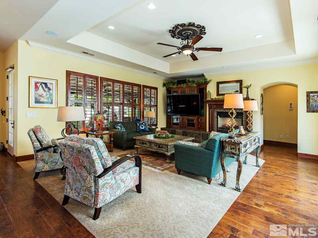 16885 Delacroix Reno, NV 89511 - Photo 12 of 25 a living room with furniture and a chandelier