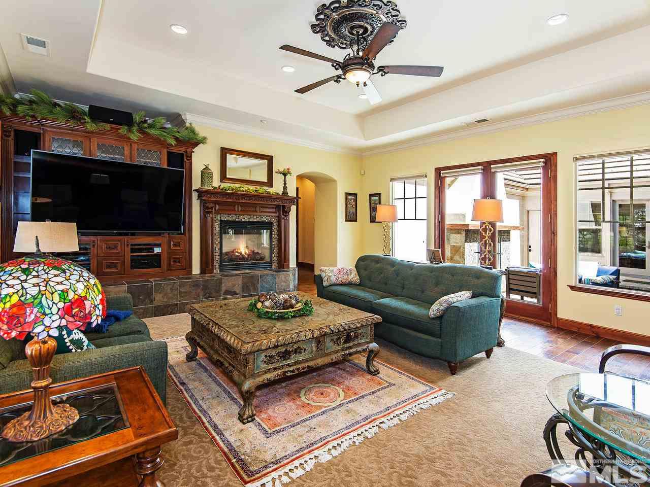 16885 Delacroix Reno, NV 89511 - Photo 13 of 25 a living room with fireplace furniture and a flat screen tv