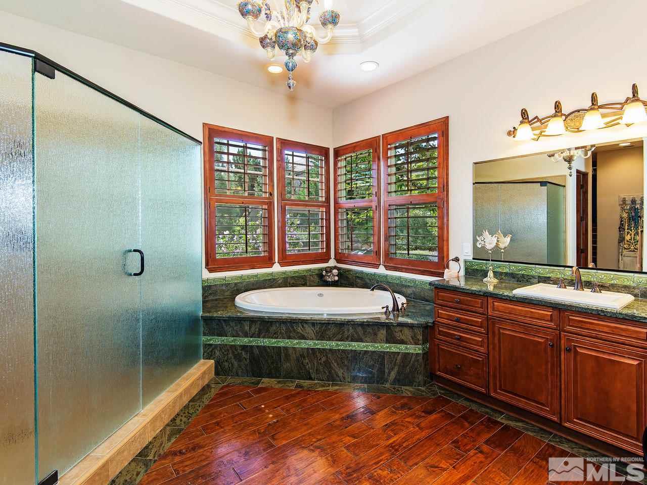 16885 Delacroix Reno, NV 89511 - Photo 17 of 25 a spacious bathroom with a tub sink and mirror