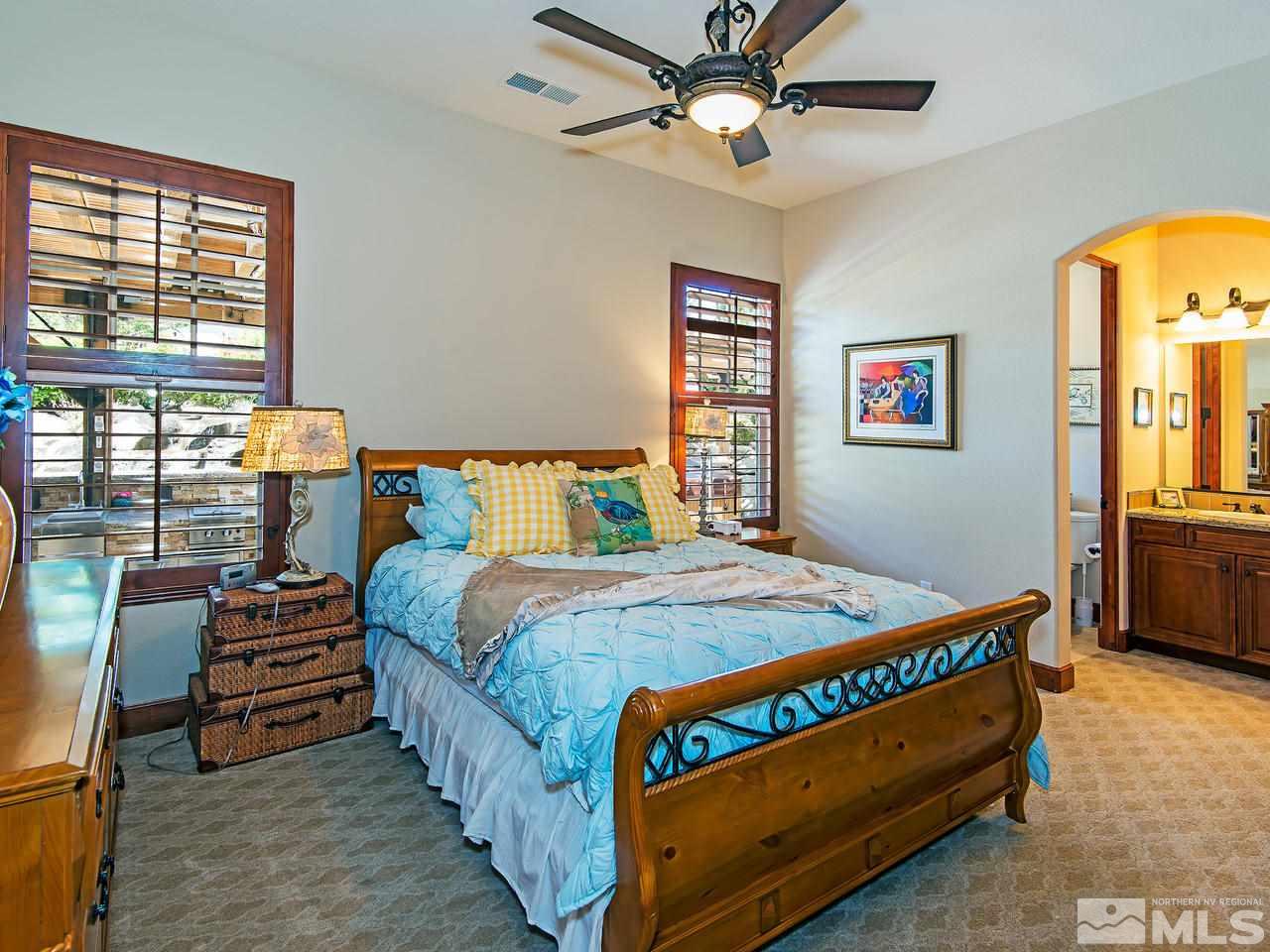 16885 Delacroix Reno, NV 89511 - Photo 20 of 25 a bedroom with a bed next to a window