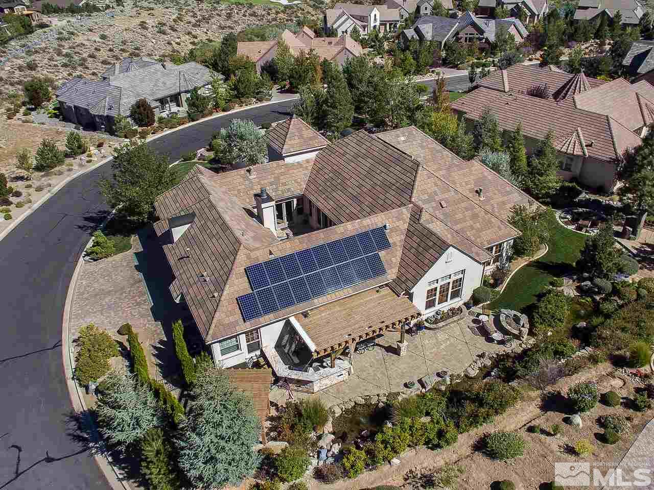 16885 Delacroix Reno, NV 89511 - Photo 2 of 25 an aerial view of a house with a yard and lake view