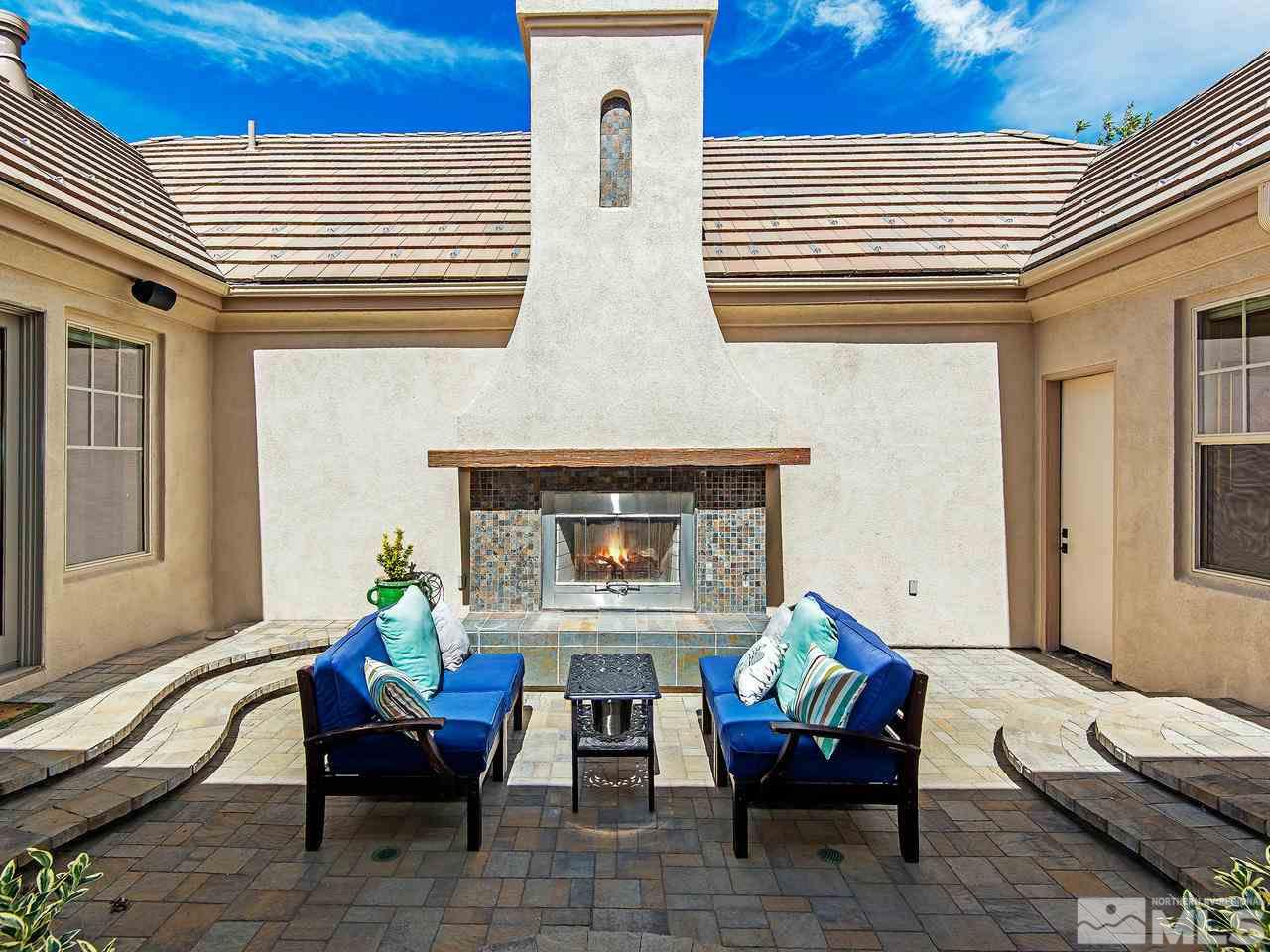 16885 Delacroix Reno, NV 89511 - Photo 21 of 25 a living room with furniture and a fireplace