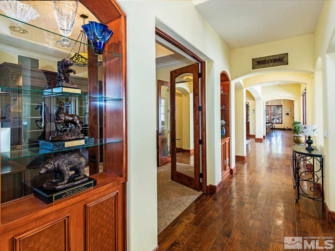 16885 Delacroix Reno, NV 89511 - Photo 3 of 25 a view of a hallway with wooden floor and windows