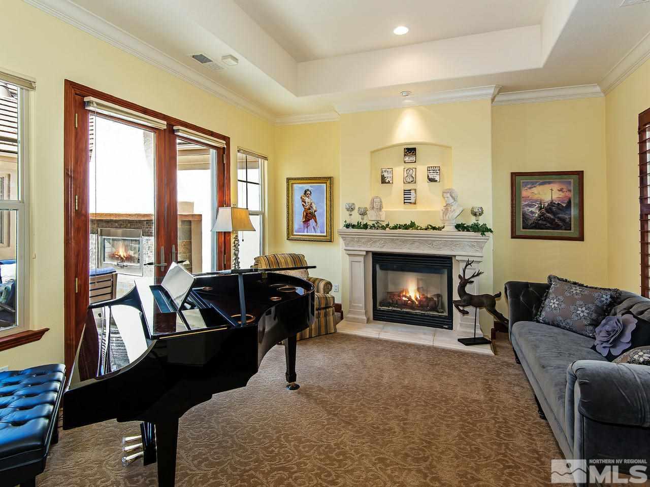 16885 Delacroix Reno, NV 89511 - Photo 5 of 25 a living room with furniture and a fireplace