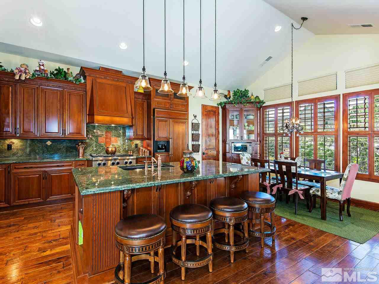 16885 Delacroix Reno, NV 89511 - Photo 10 of 25 a large kitchen with a table and chairs