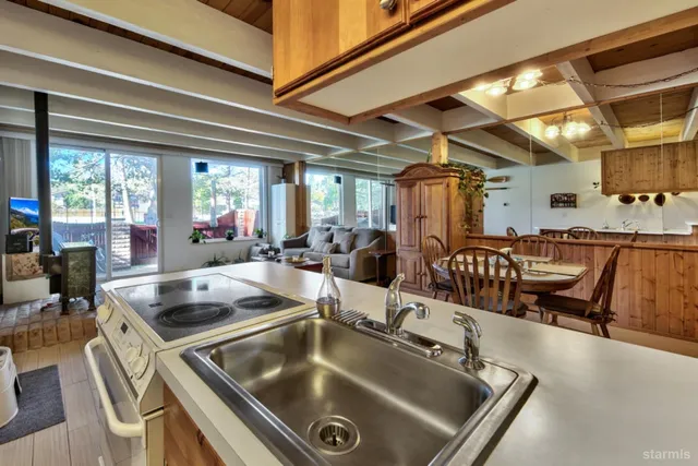 a kitchen with a table chairs and couches