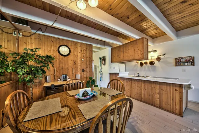 a dining room with furniture and wooden floor