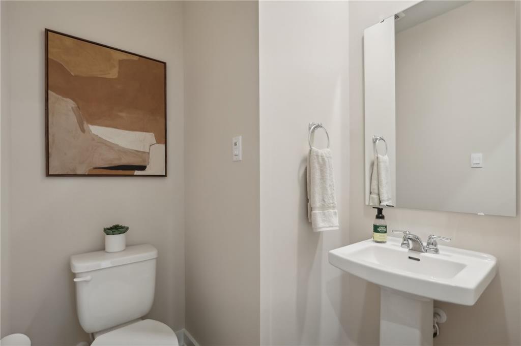 130 River Ridge Drive Coraopolis, PA 15108 - Photo 13 of 20 a bathroom with a toilet a sink and mirror