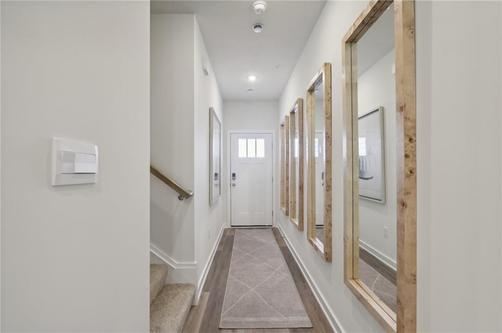 130 River Ridge Drive Coraopolis, PA 15108 - Photo 2 of 20 a view of a hallway with wooden floor and staircase