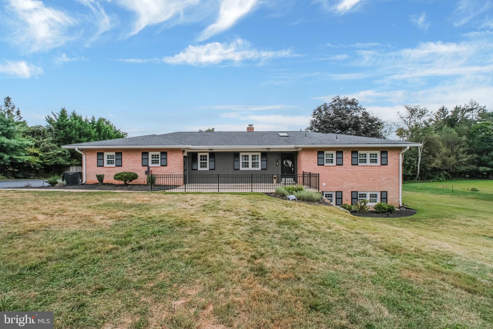 front view of a house with a big yard