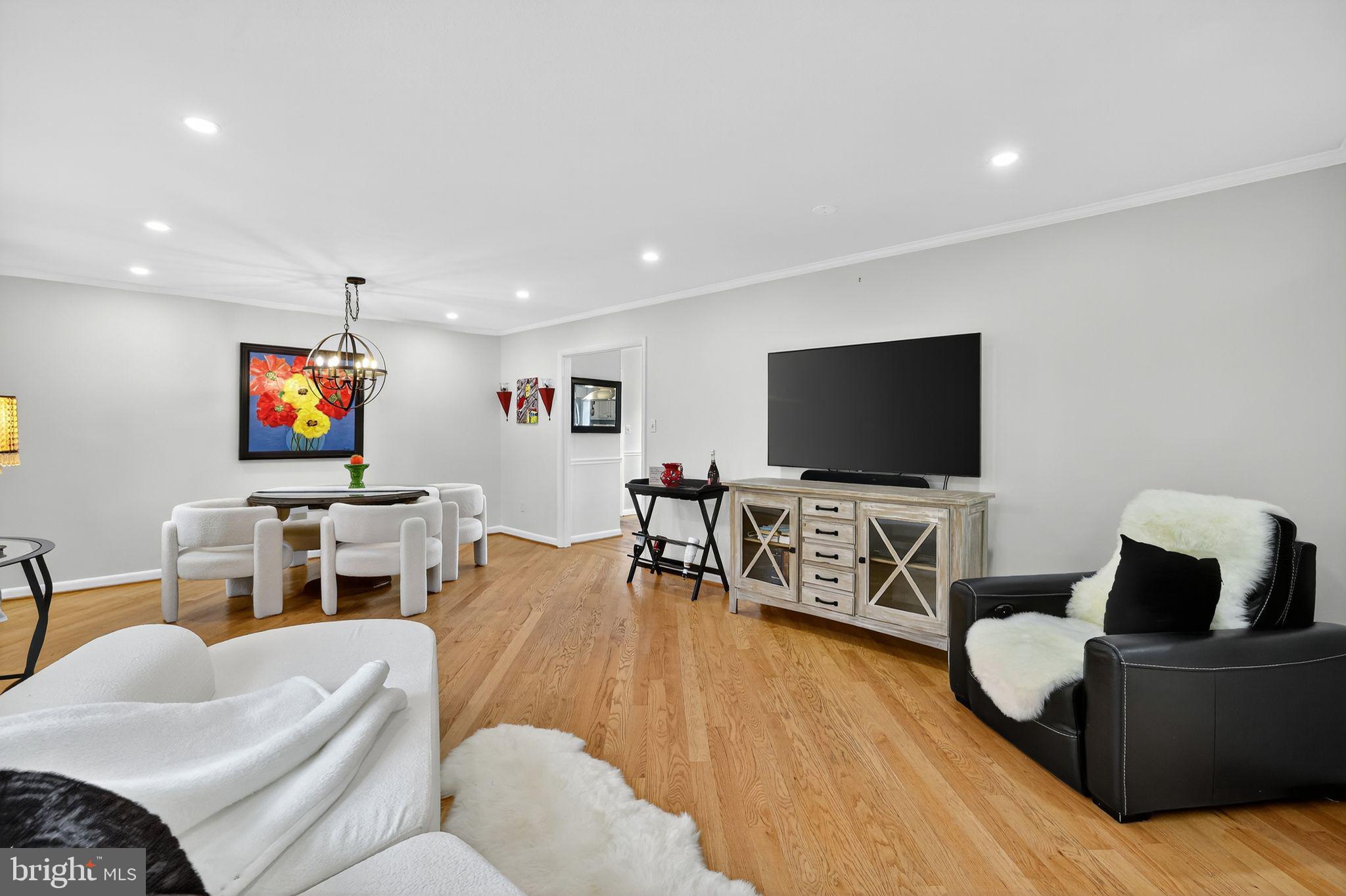 1716 Gayfields Drive Silver Spring, MD 20906 - Photo 11 of 55 a living room with furniture and a flat screen tv
