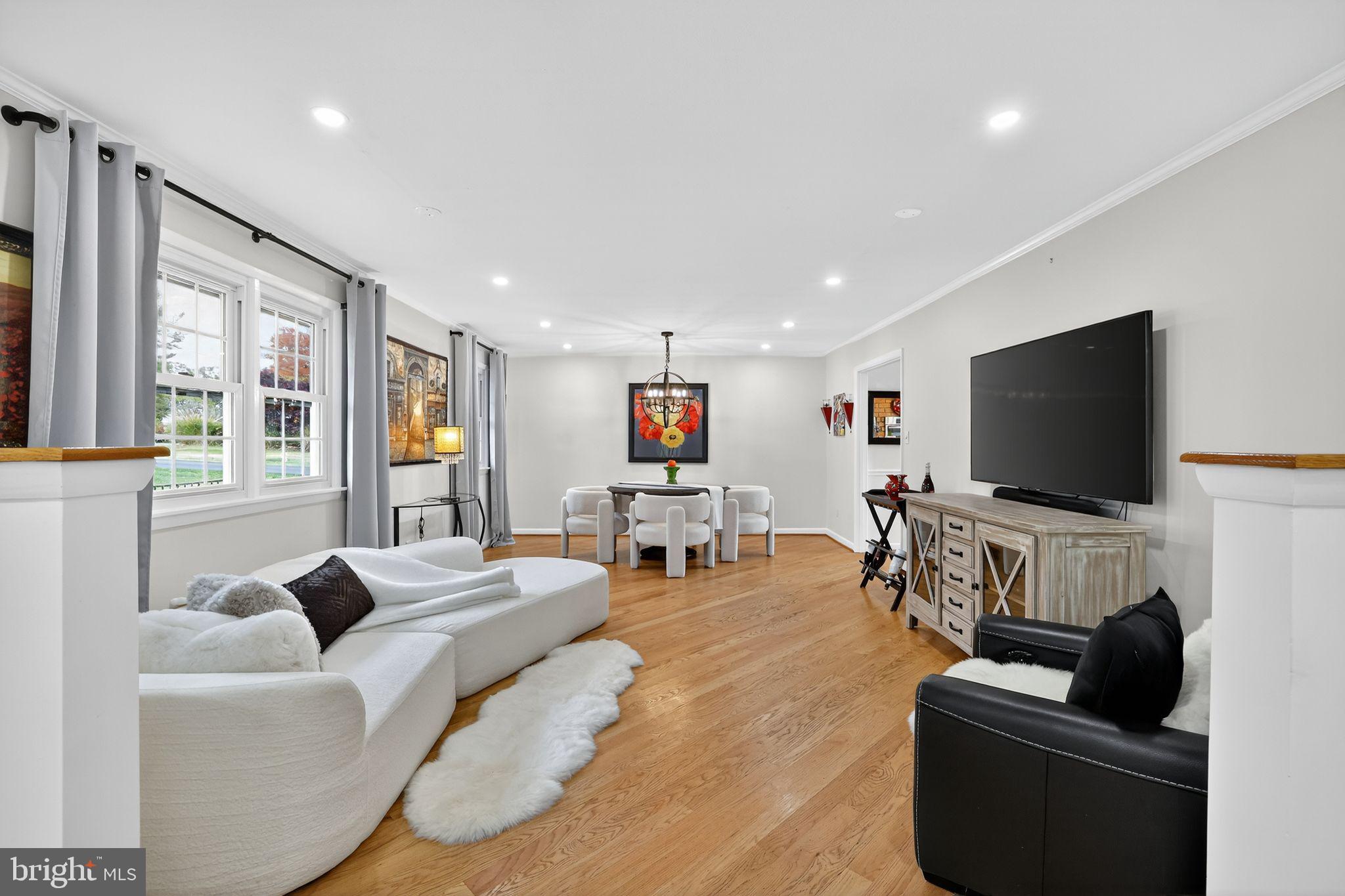 1716 Gayfields Drive Silver Spring, MD 20906 - Photo 16 of 55 a living room with furniture and a flat screen tv
