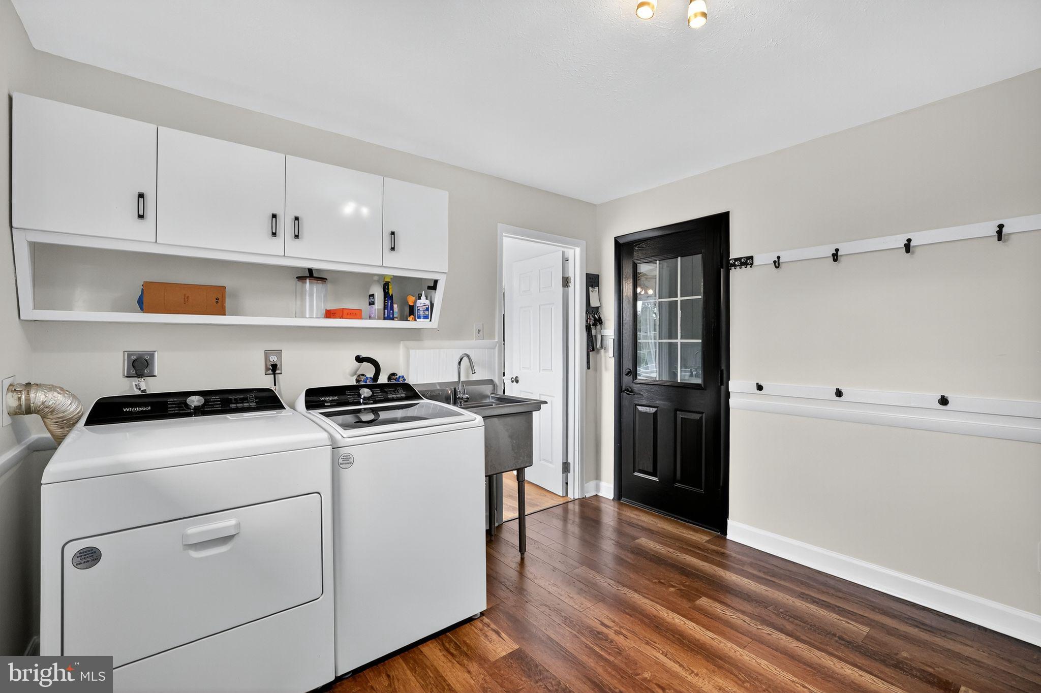 1716 Gayfields Drive Silver Spring, MD 20906 - Photo 27 of 55 a kitchen with cabinets appliances and wooden floor