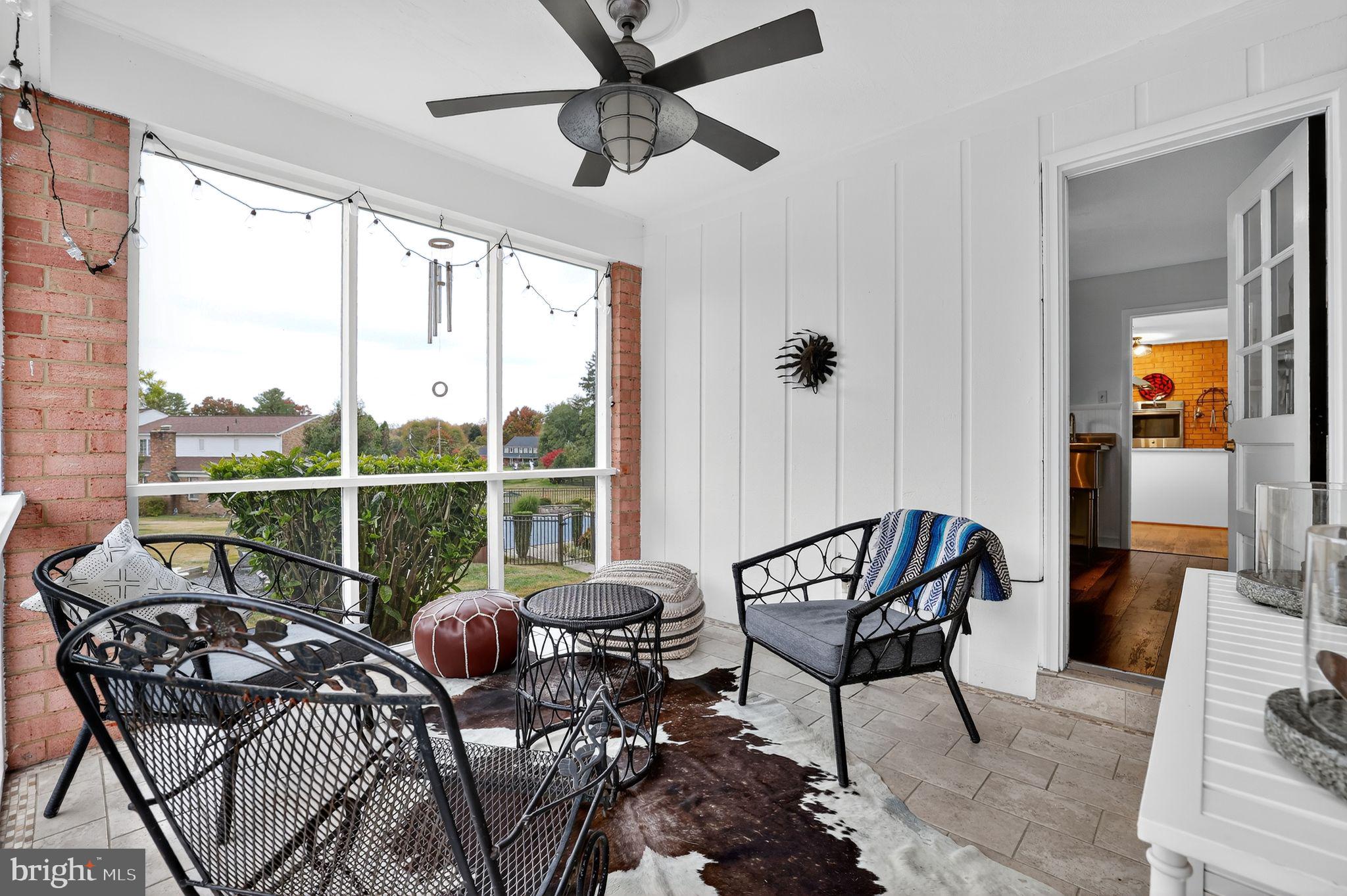 1716 Gayfields Drive Silver Spring, MD 20906 - Photo 28 of 55 a living room with furniture and a floor to ceiling window