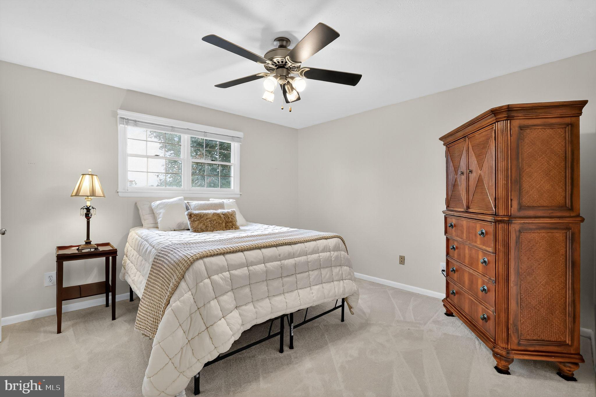 1716 Gayfields Drive Silver Spring, MD 20906 - Photo 36 of 55 a bedroom with a bed and a chandelier