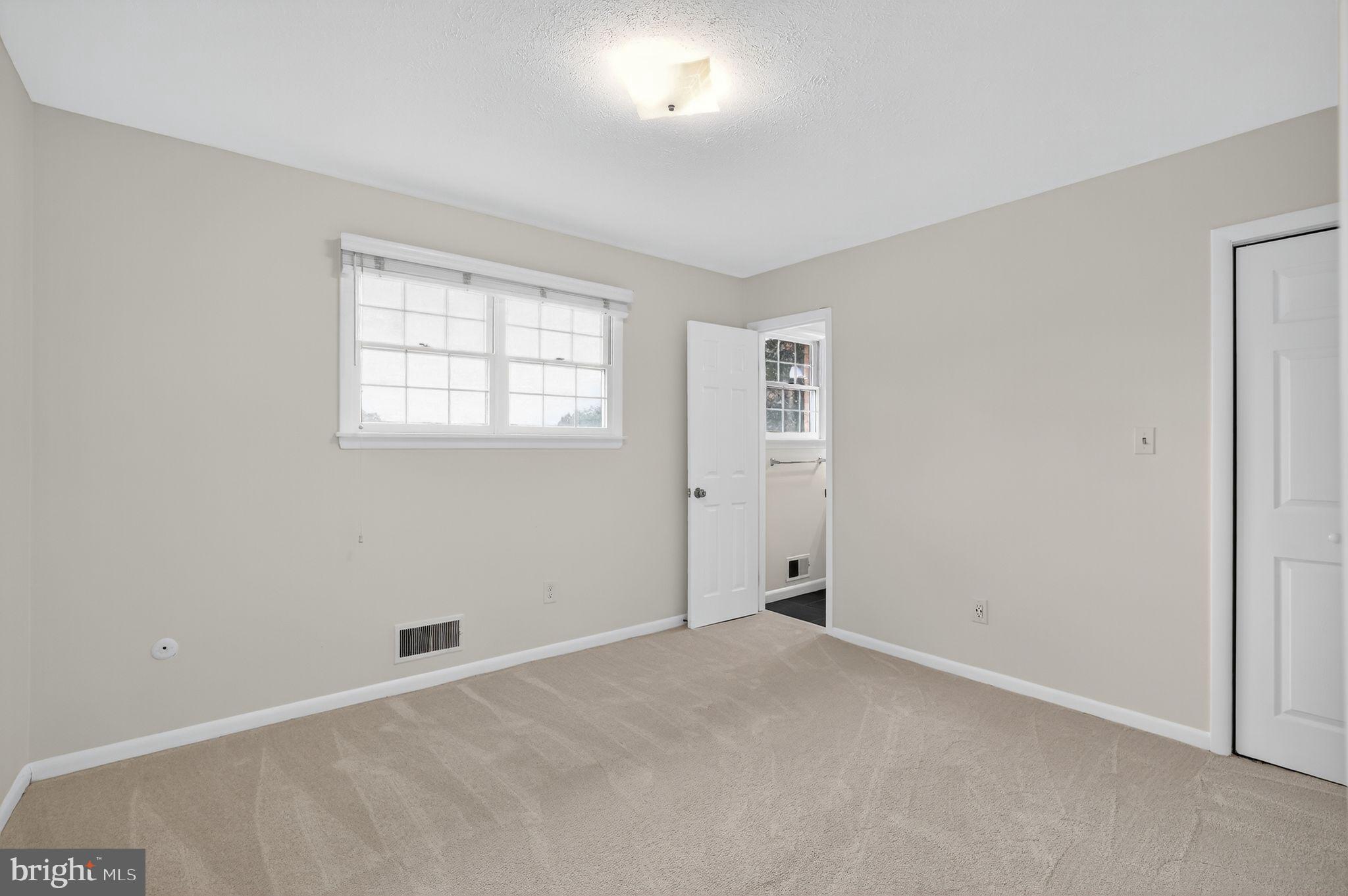 1716 Gayfields Drive Silver Spring, MD 20906 - Photo 41 of 55 an empty room with windows