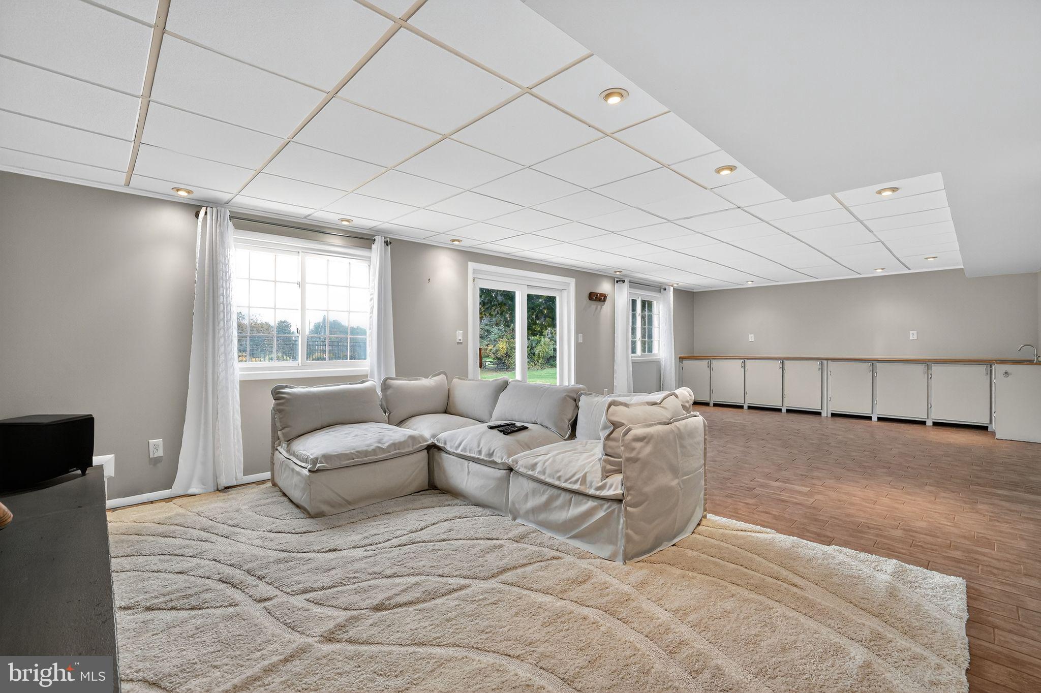 1716 Gayfields Drive Silver Spring, MD 20906 - Photo 45 of 55 a living room with furniture and a large window