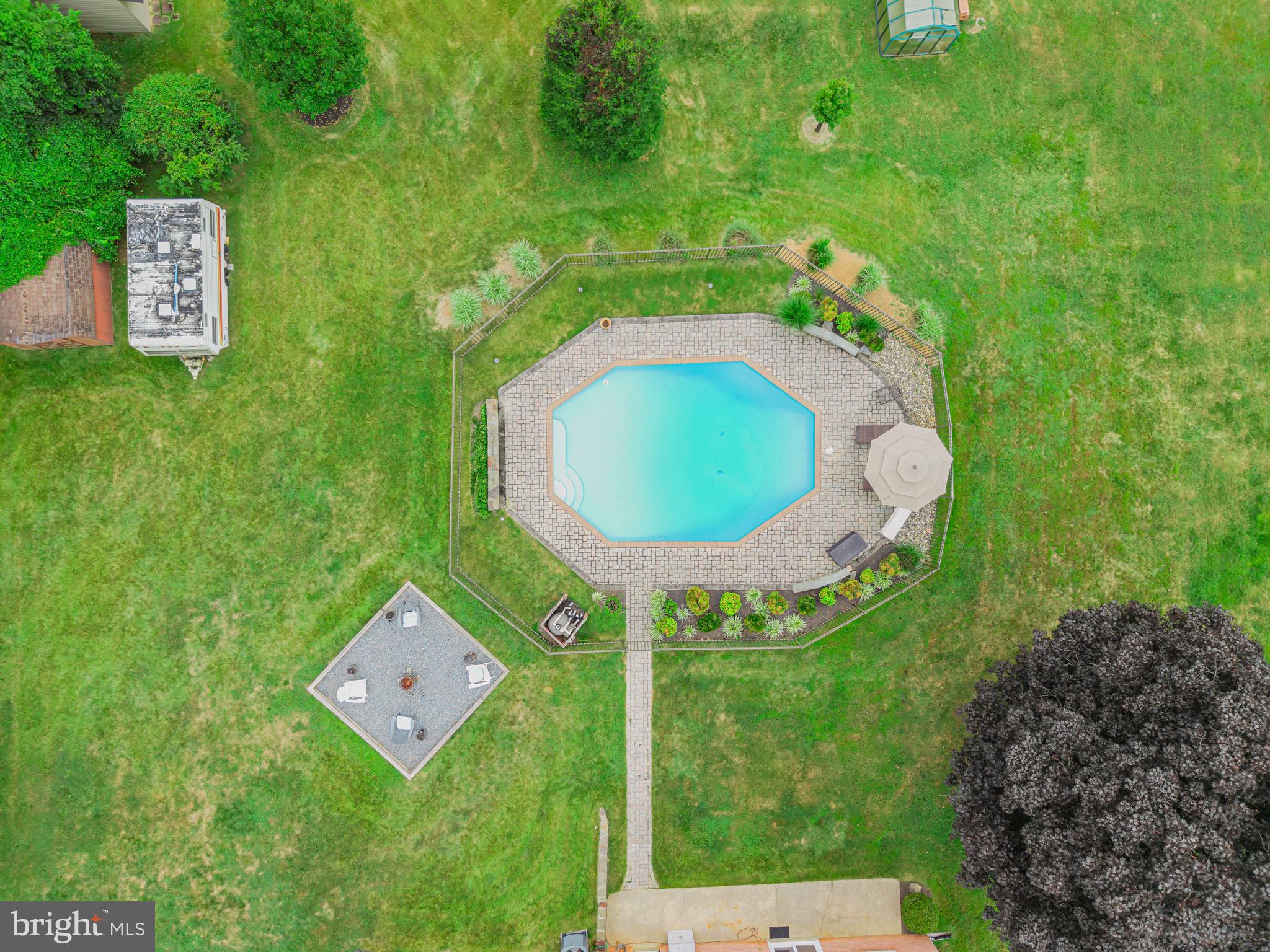 1716 Gayfields Drive Silver Spring, MD 20906 - Photo 7 of 55 a backyard of a house with table and chairs