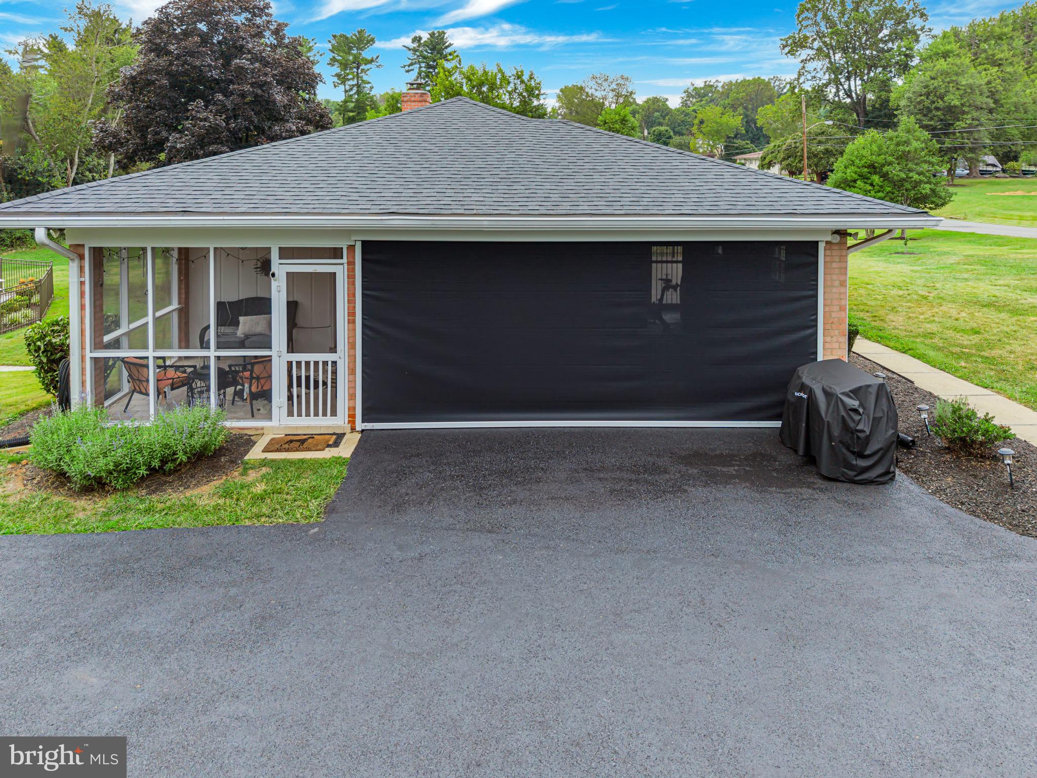 1716 Gayfields Drive Silver Spring, MD 20906 - Photo 10 of 55 a front view of a house with garden