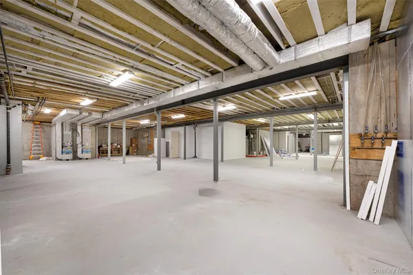 a view of water heater room with stairs