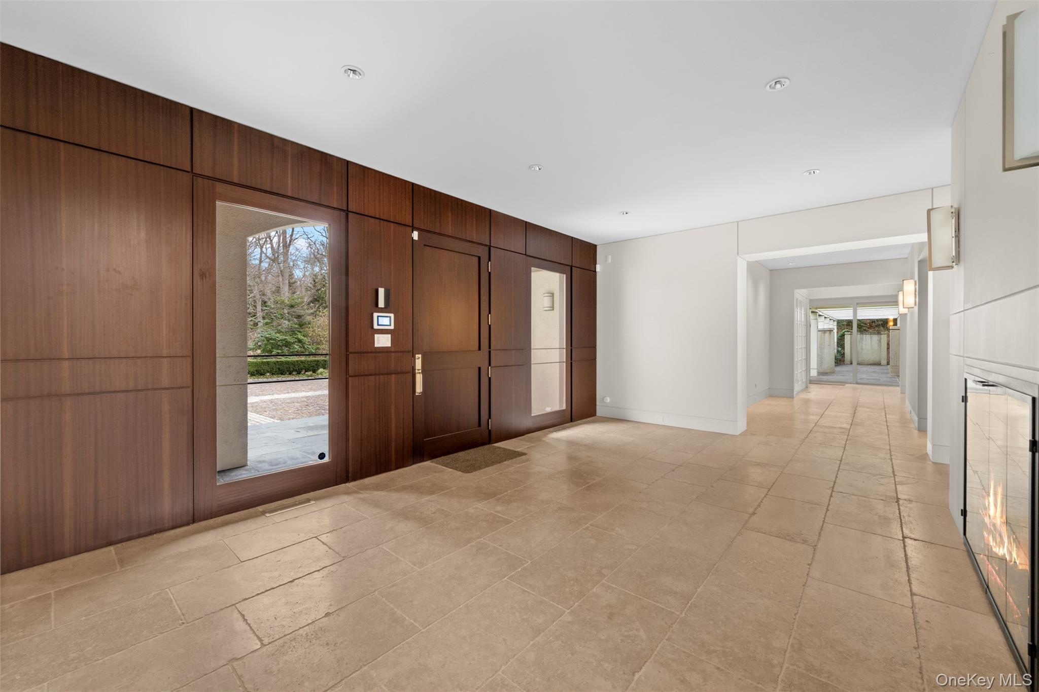 121 Piping Rock Road Locust Valley, NY 11560 - Photo 2 of 14 a view of an empty room with a window