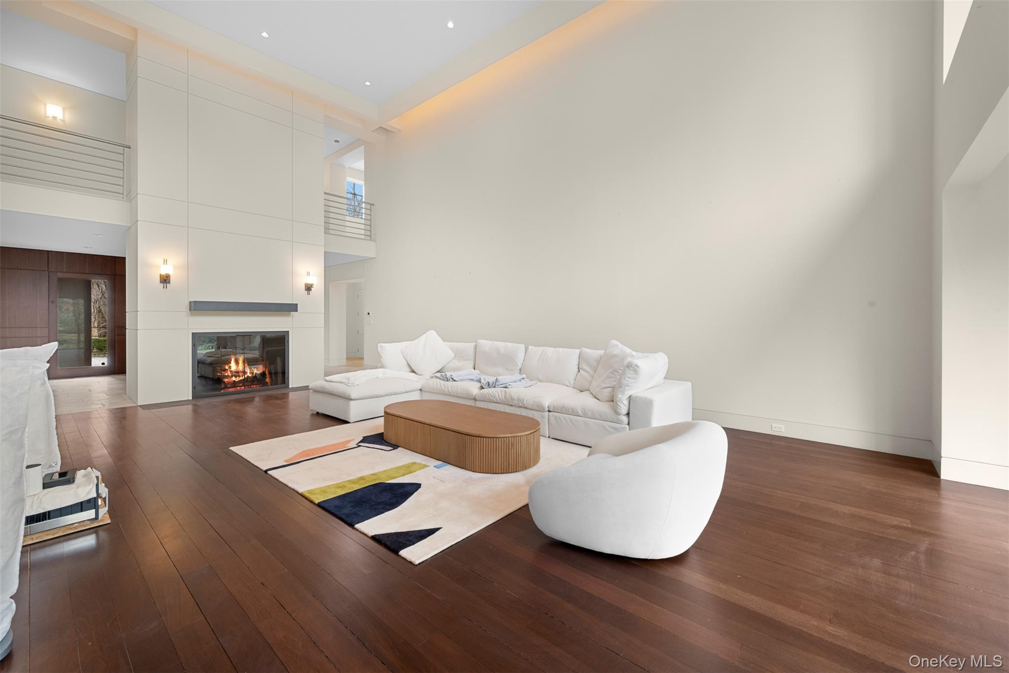 121 Piping Rock Road Locust Valley, NY 11560 - Photo 5 of 14 a living room with furniture and a fireplace