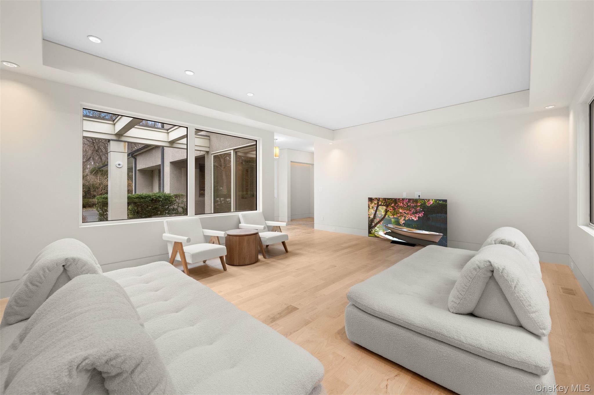 121 Piping Rock Road Locust Valley, NY 11560 - Photo 6 of 14 a living room with furniture and a large window