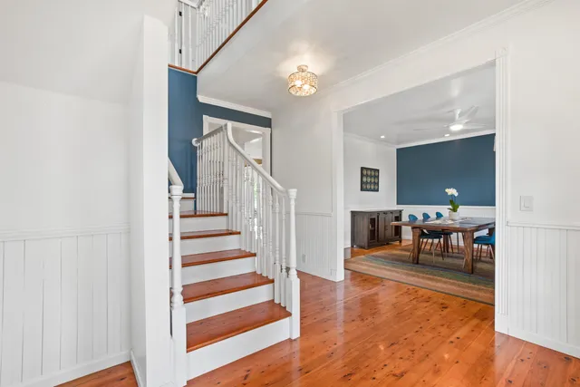 a view of a livingroom with furniture and entryway