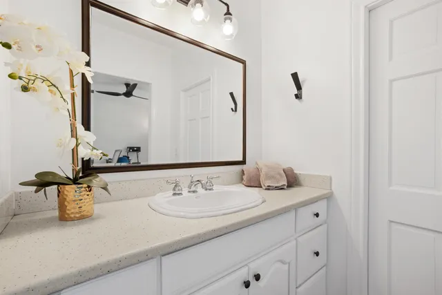 a bathroom with a sink and a mirror