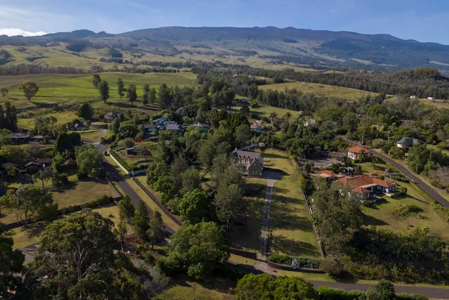 an aerial view of residential house with outdoor space