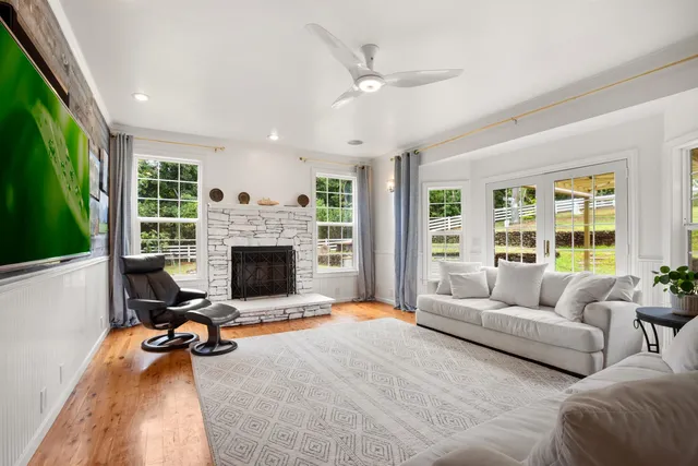 a view of a livingroom with furniture and a fireplace