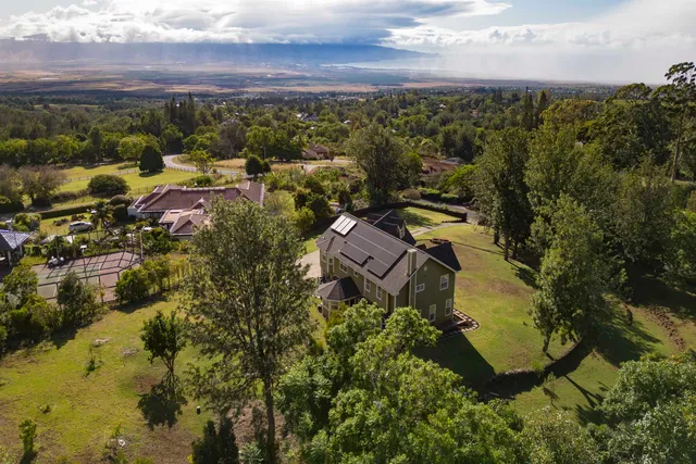 an aerial view of residential house with outdoor space