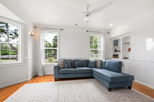 a living room with furniture and a window