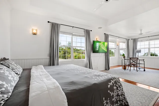 a bedroom with a large bed and a table