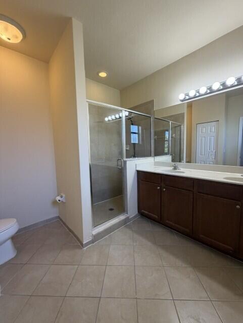 23765 Southwest 118 Avenue, Unit 23765 Homestead, FL 33032 - Photo 13 of 36 a bathroom with a sink mirror and toilet