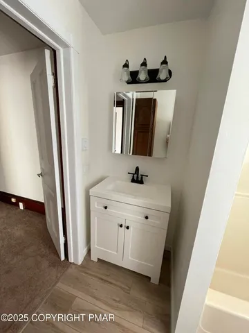 a view of a kitchen with a sink and washing machine
