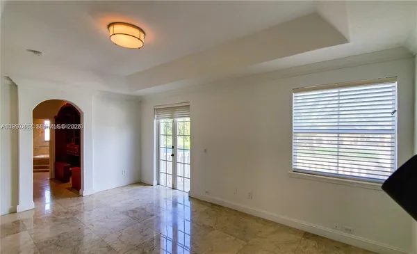 a bathroom with a glass shower door and a bathtub