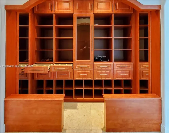 en empty room with closet and wooden floor