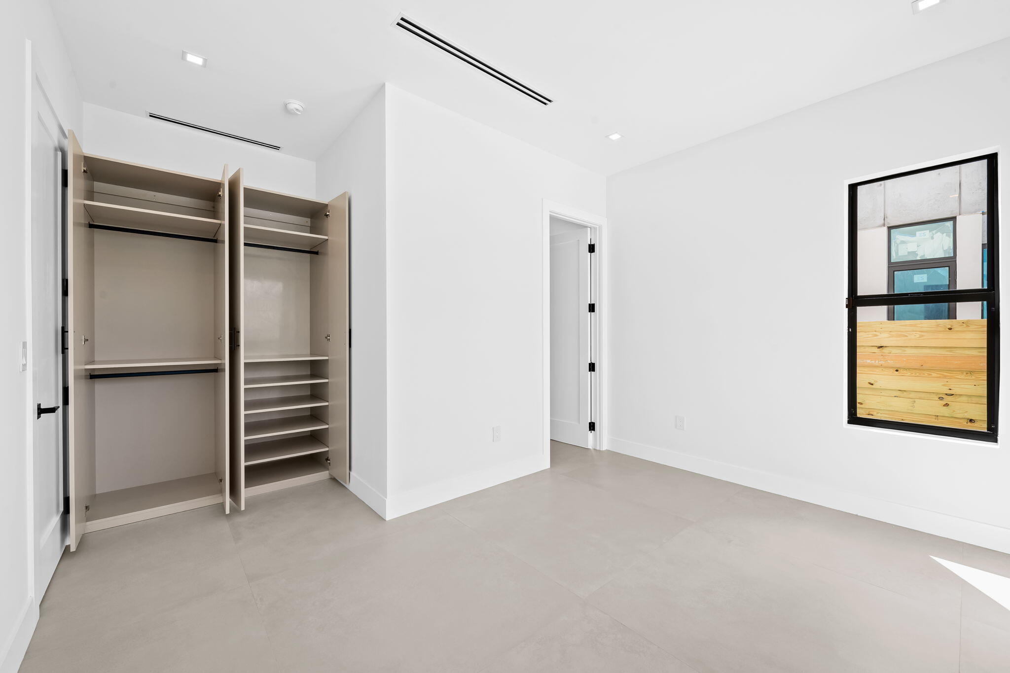 2324 Southwest 26th Street Miami, FL 33133 - Photo 12 of 45 a view of an empty room with a window